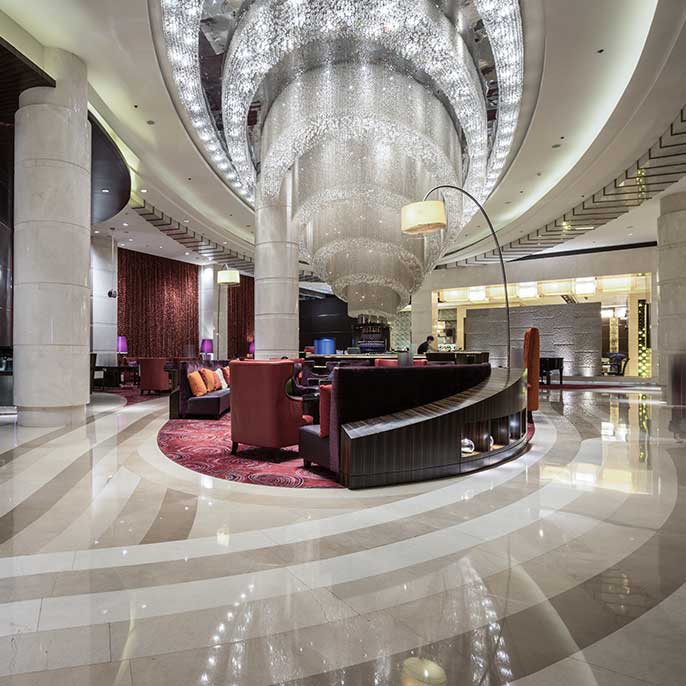 Hotel lobby with elegant staircase.